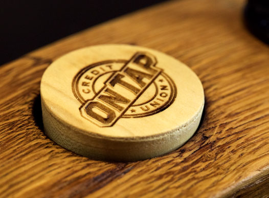 photo of wooden plug with on tap logo